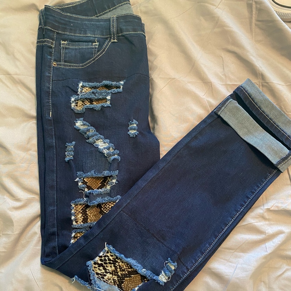 Jeans with snake print underlay